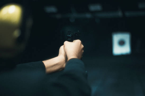 istock Close up shot of an unrecognizable man shooting at the Shooting Range 1346901834