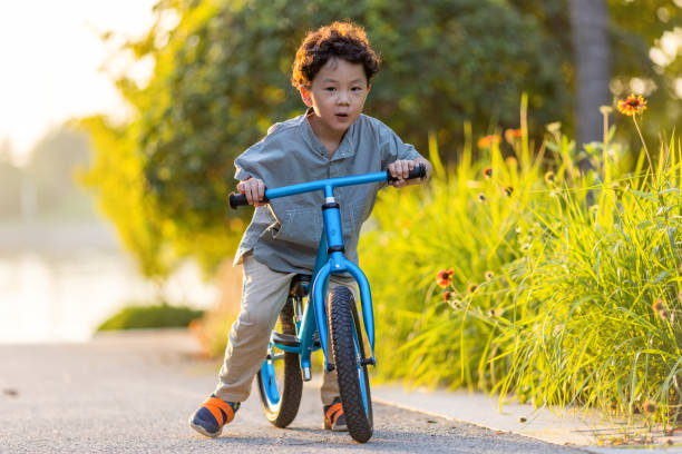 istock A little boy riding a bicycle 1346902284