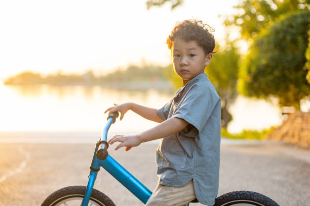 istock A little boy riding a bicycle 1346902340