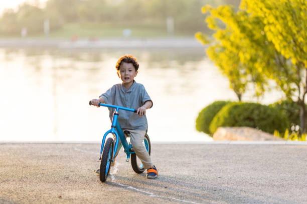 istock A little boy riding a bicycle 1346902360