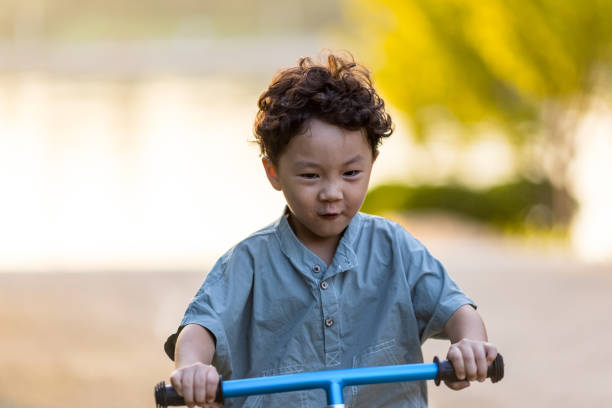 istock A little boy riding a bicycle 1346902980