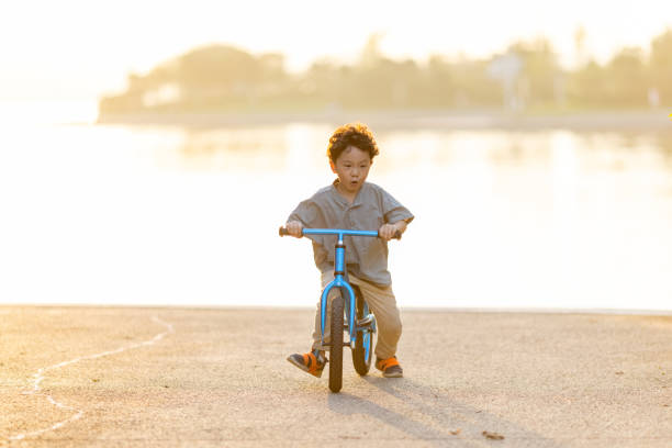 istock A little boy riding a bicycle 1346902982