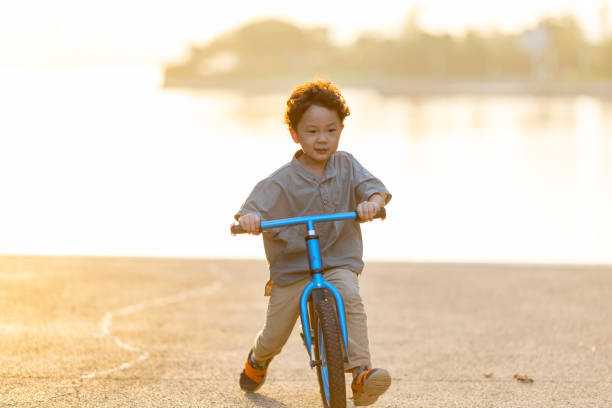 istock A little boy riding a bicycle 1346902986