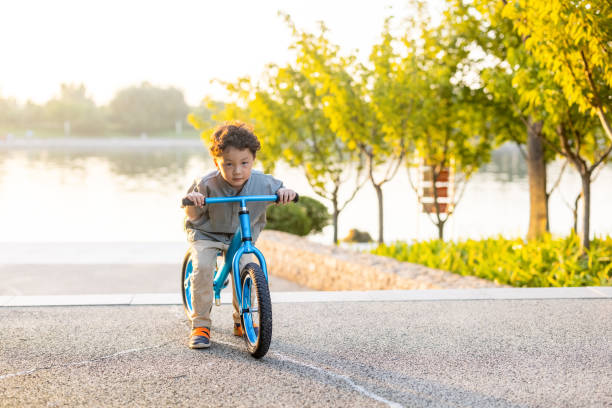 istock A little boy riding a bicycle 1346903032