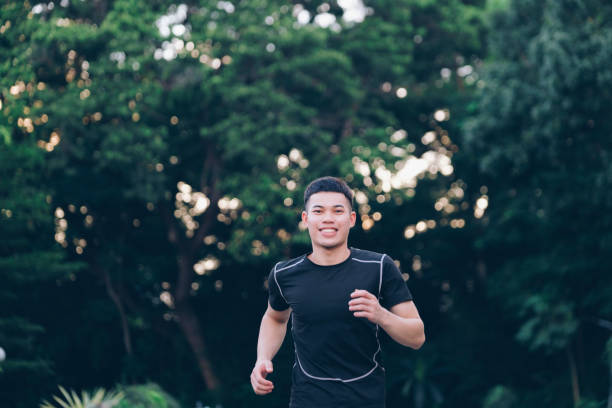 istock Athletic young man running in the nature. 1346904032