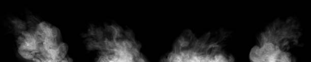 istock group of white smoke or steam spray 1346905635
