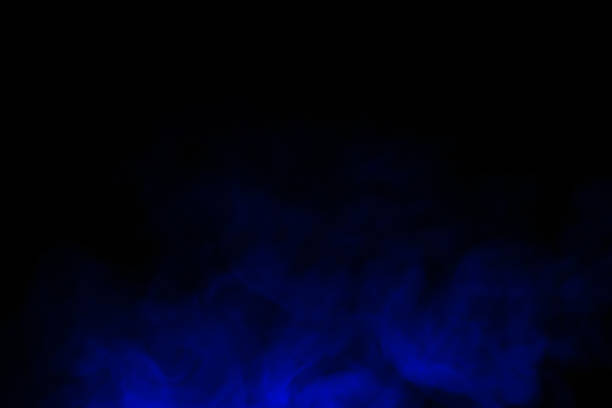 blue smoke with spray from Close-up of blue smoke with spray from a humidifier. Isolated on black background fog transparent stock pictures, royalty-free photos & images
