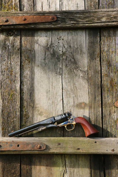 istock Black powder revolver on an old board 1346909910