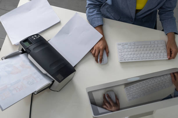 istock Asian woman scanning business documents. Top view. 1346910180