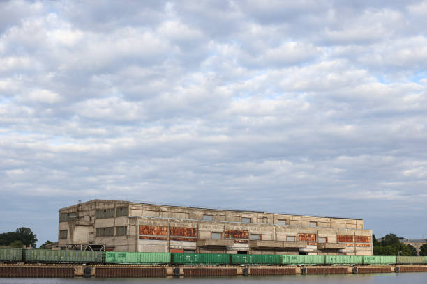 istock Cargo train standing near old brick building in docks. 1346910358