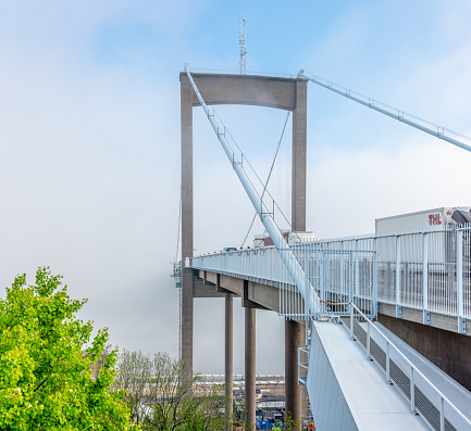 Gothenburg, Sweden - May 31 2021: Thick morning fog enveloping the middle of Älvsborgsbron.