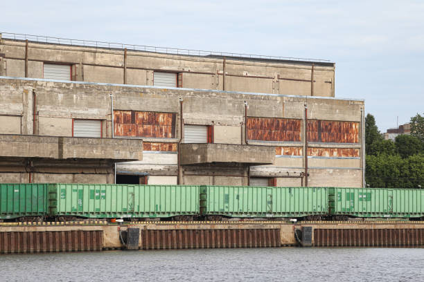 istock Cargo train standing near old brick building in docks. 1346911236