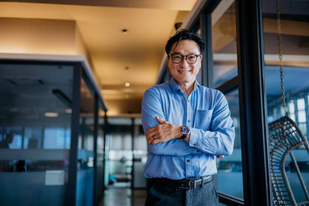 istock Confidence mature businessman in office 1346912584