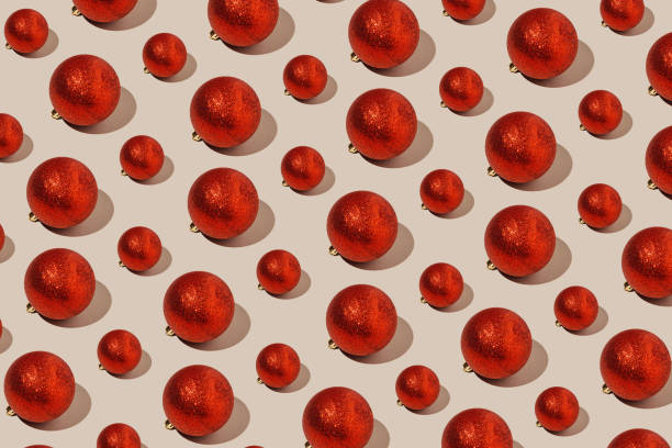 istock Simple pattern made of red baubles on pastel background. Creative winter composition. Christmas party and festive concept. Minimal style. 1346914014