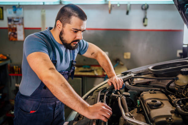 istock Professional mechanic repairing a car 1346915911