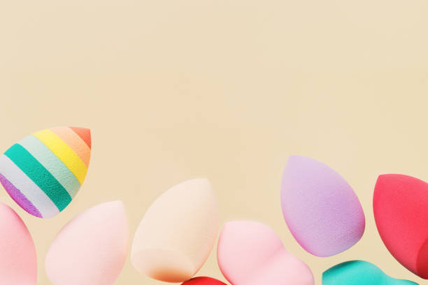 istock Colorful cosmetic beauty sponges different form Red, pink, rainbow colored makeup tools 1346916100