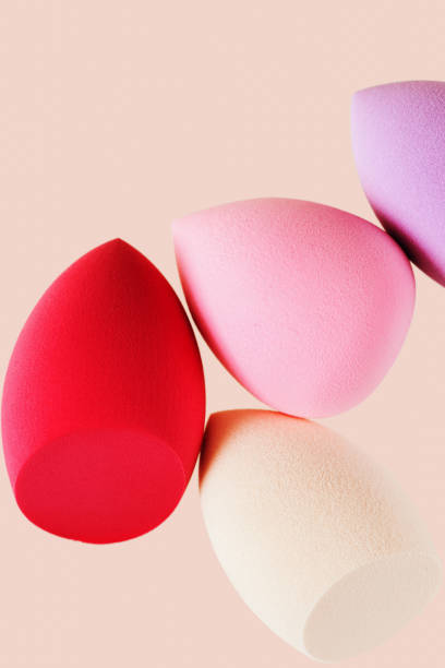 istock Bright cosmetic beauty sponges different form Red and pink colored makeup tools for tone cream, foundation, concealer. 1346916106