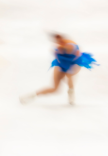 Unrecognisable and unidentifiable skater. Long exposure of figureskater creating an artful image of the beauty of figure skating. Art image