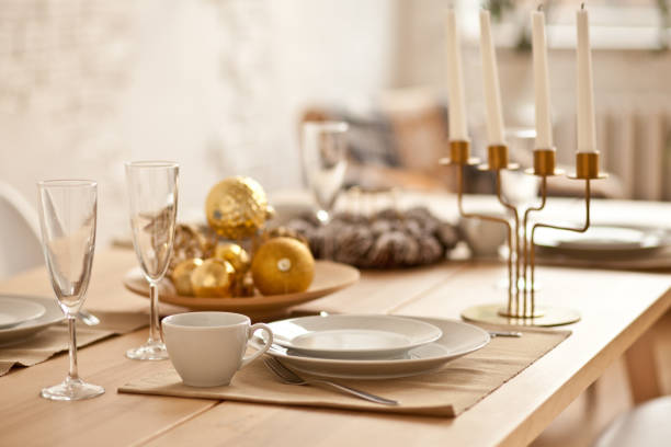 Christmas table setting with holiday decorations. New Year celebration.