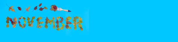 istock the word November from the leaves on a blue background 1346917844