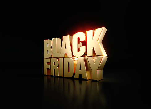Gold colored letters writing Black Friday over black background. Horizontal composition with copy space. Directly above. Great use for Black Friday concepts.