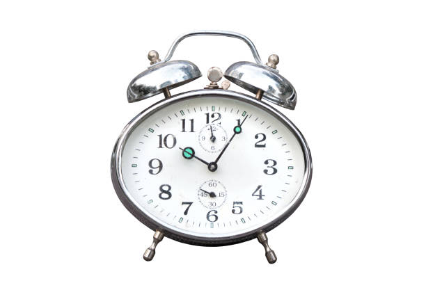 istock Old vintage alarm clock isolated on white background 1346919082