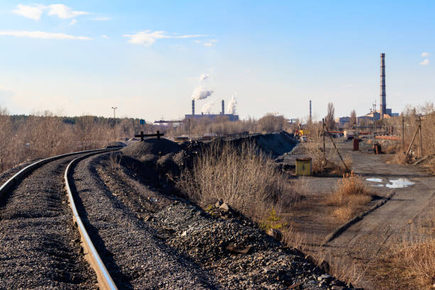 istock Railway tracks in the industrial zone with factories 1346921690