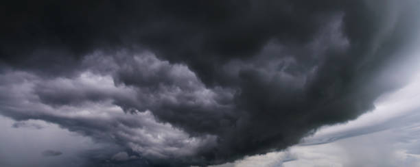 istock Stormy rain clouds background. Dark sky above field.selection focus. 1346923511
