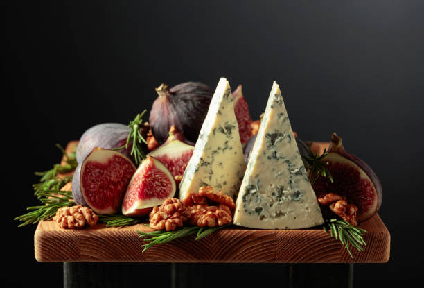 istock Blue cheese with figs, walnuts, and rosemary. 1346926296