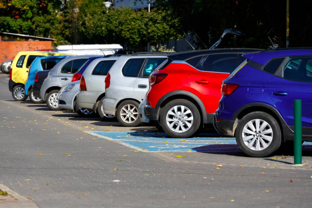 Cars parked in row in outdoor parking in Goclaw housing district stock photo