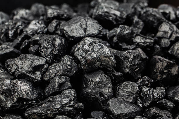 istock Heap of coal as background, top view 1346927625