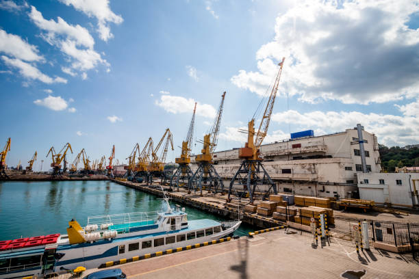 Seaport in Odessa on a sunny day. Cargo, cranes, containers, liners.