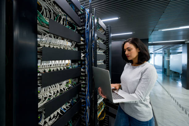 istock Hacker fixing an outage in the server room 1346929950