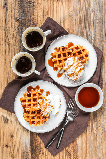 Breakfast Waffles with cream and Caramel syrup with coffee