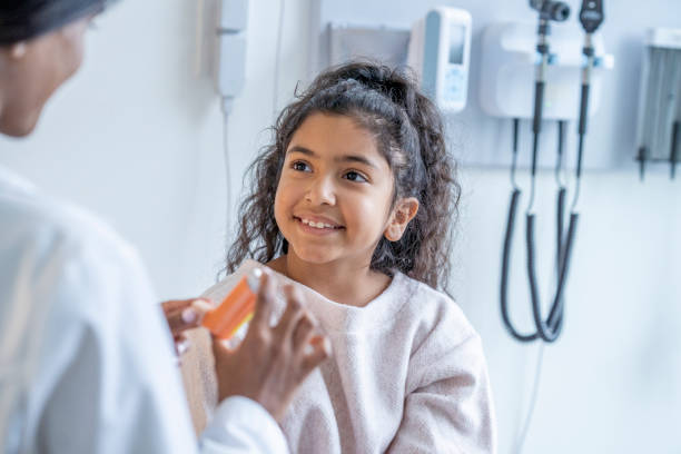 istock Doctor Instructing a Young Patient on Proper Inhaler Usage 1346931652