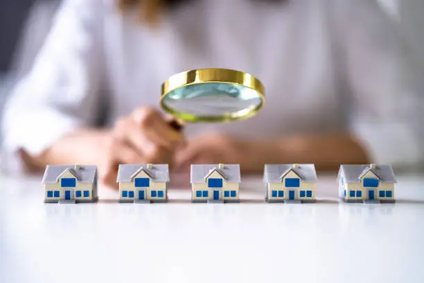Real Estate House Inspection Before Purchase. Inspector Using Magnifier Glass