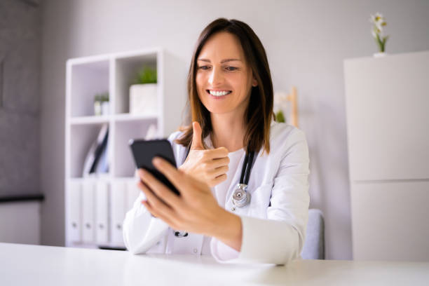 istock Doctor Having Video Conference On Phone 1346932442