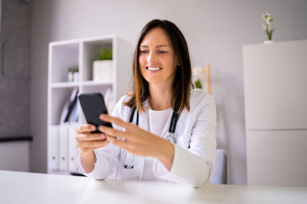 istock Doctor Having Video Conference On Phone 1346932453