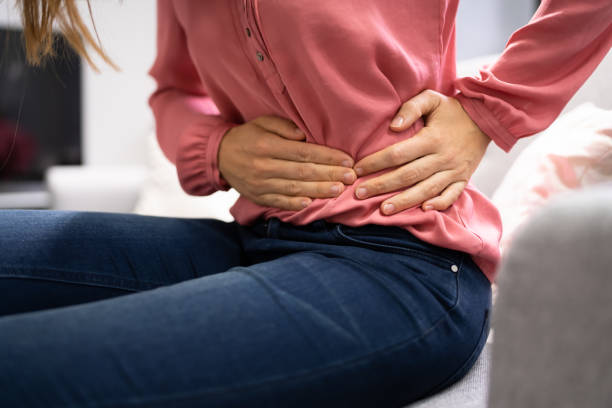 istock Sick Woman With Abdominal Pain 1346932838