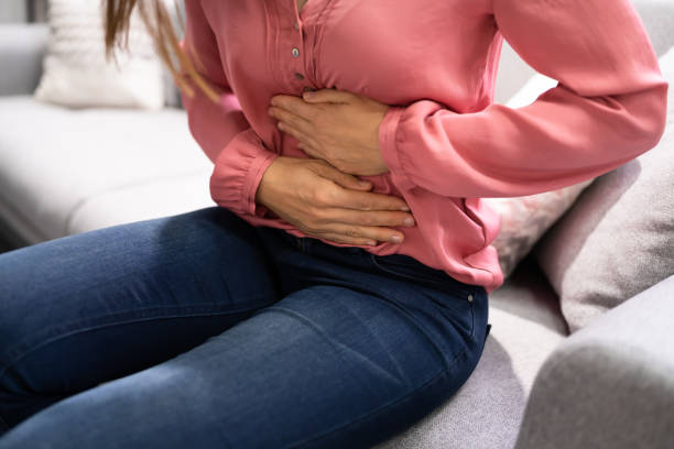istock Sick Woman With Abdominal Pain 1346932839