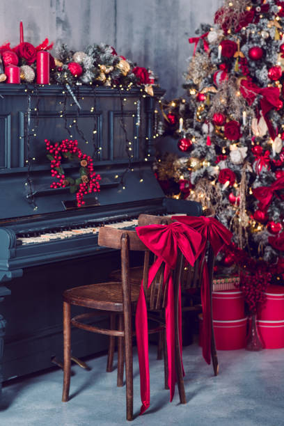 istock Christmas eve, piano with decor. New Year 1346934337