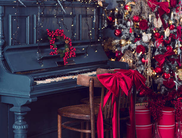 istock Christmas eve, piano with decor. New Year 1346934339