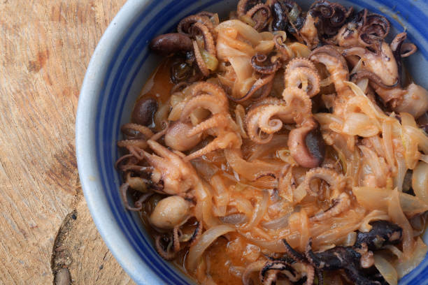 istock octopus with onion as mediterranean seafood dish 1346936192