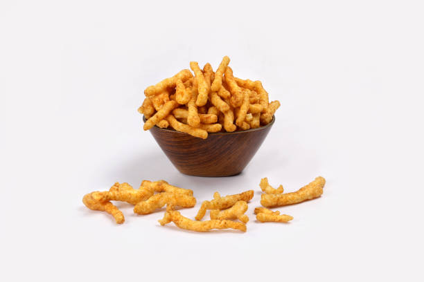 istock SNACKS STICKS CORN, isolated Image kurkure or namkeen sticks, background image. 1346939024