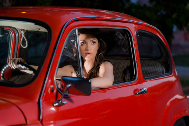 istock The Lady And The Red Car 1346941816
