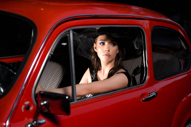 istock The Lady And The Red Car 1346941944