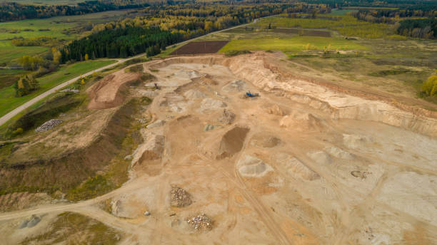 istock Open pit gravel mining.  Limestone quarry, mining rocks and stones photographed from above with a drone. 1346943101