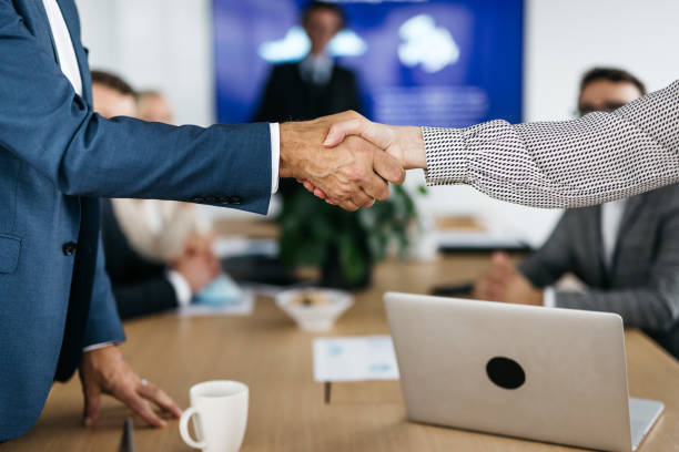 istock Close-up of business partners shaking hands 1346944132