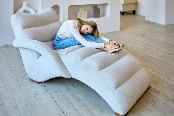 istock Slender woman is lying on lounge chair during rest. 1346946852