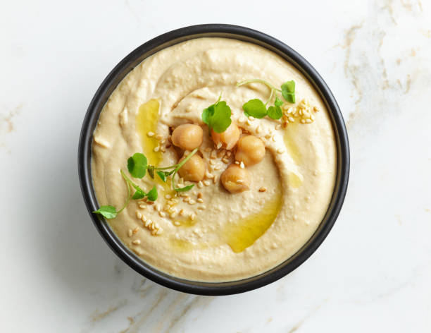istock bowl of hummus on kitchen table 1346949585